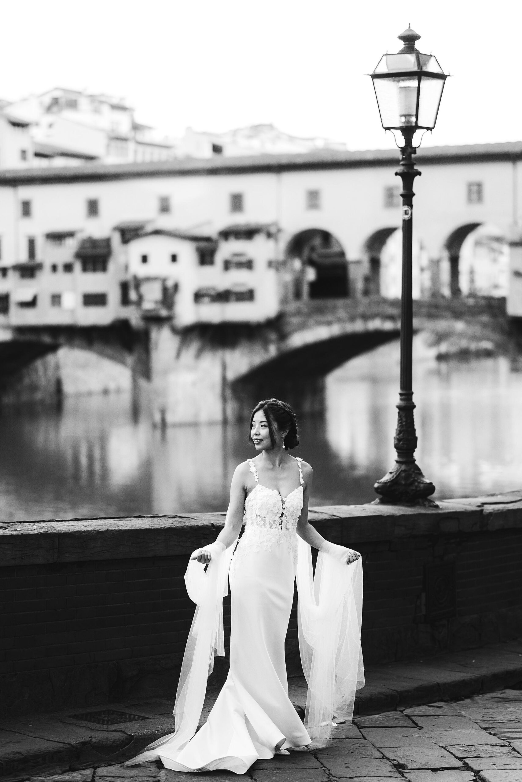 Beautiful bridal portrait near Ponte Vecchio during sunrise with no tourists around