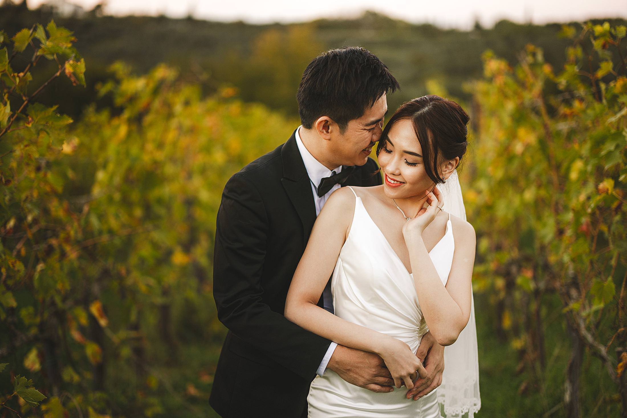 Elegant bride and groom pre-wedding photo session in the charming area of the Chianti countryside during golden hour