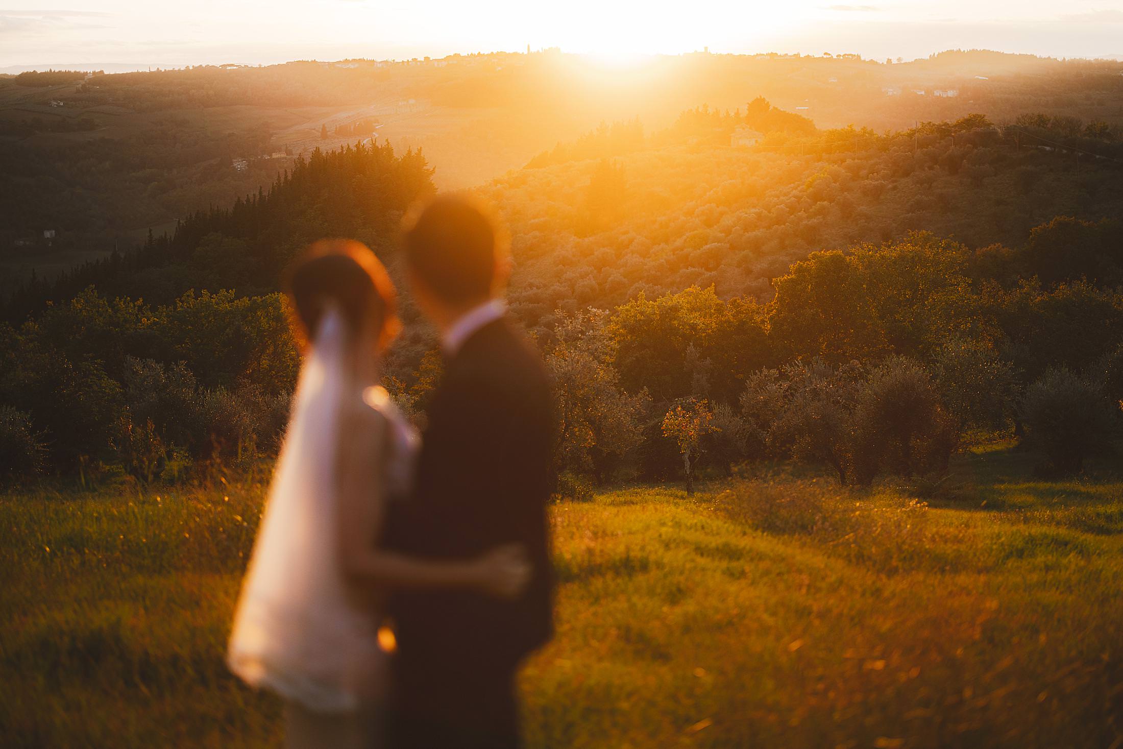 The romantic couple photo session in the Chianti countryside at magical time of golden hour