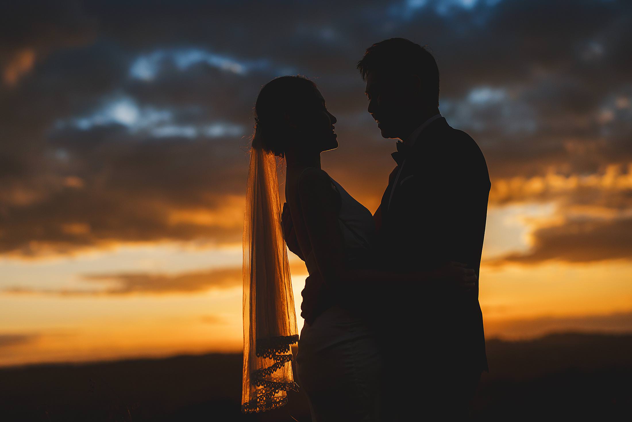 Romantic couple pre-wedding portrait in the dreaming sunset Chianti countryside