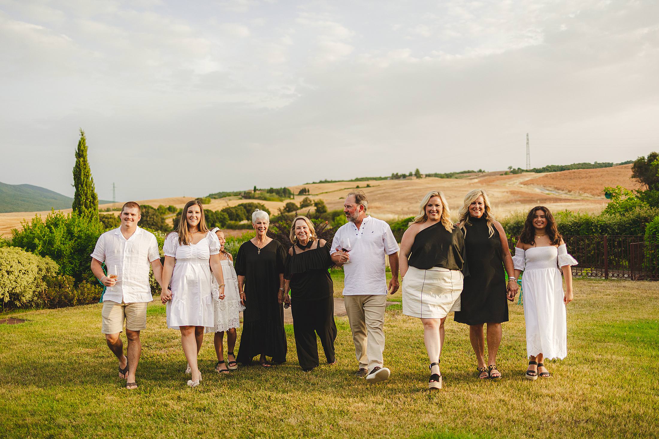 Exciting candid family reunion photos with dreaming rolling hills of Tuscany countryside