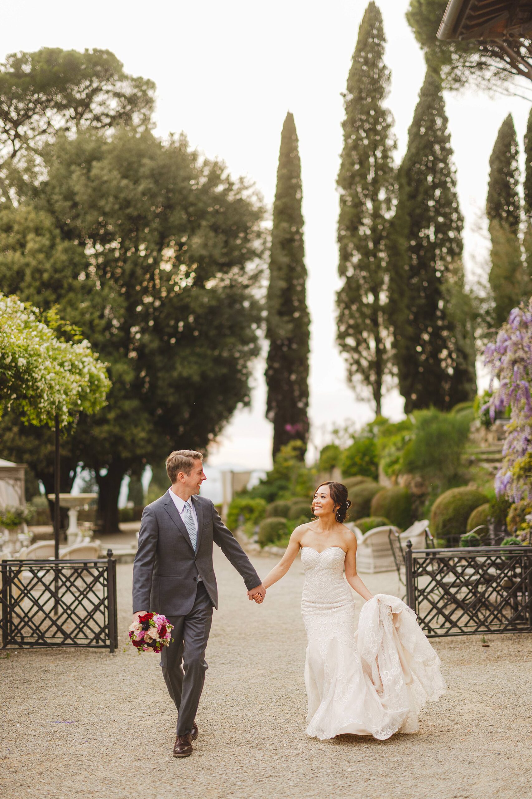 Exciting and joyful candid bride and groom elopement portrait at Villa Le Fontanelle just outside Florence